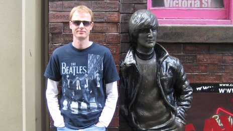 Writer of John Lennon's Last Day, Stephen Kennedy, next to the John Lennon statue outside the Cavern in Liverpool