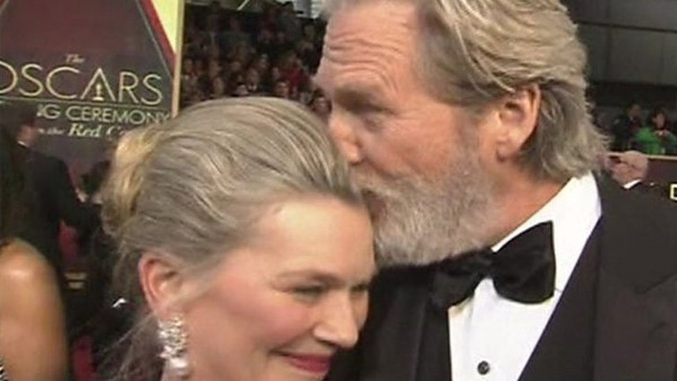 Jeff Bridges is saved from embarrassment by wife on the red carpet