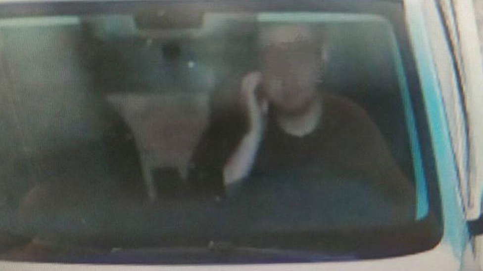 Chinese driver gets ticket for scratching his face