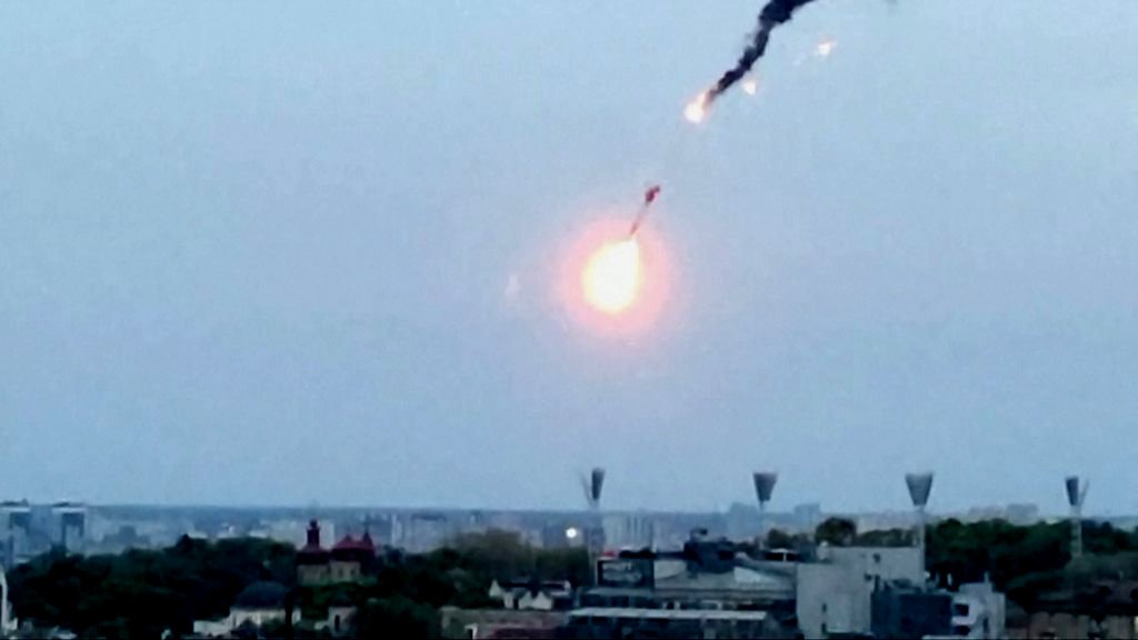 Drone shot down over Kyiv burns through sky