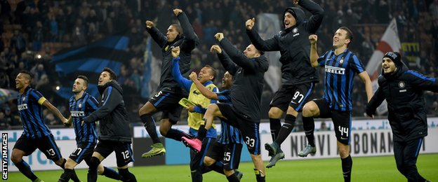 Inter Milan's players celebrate going top of the table