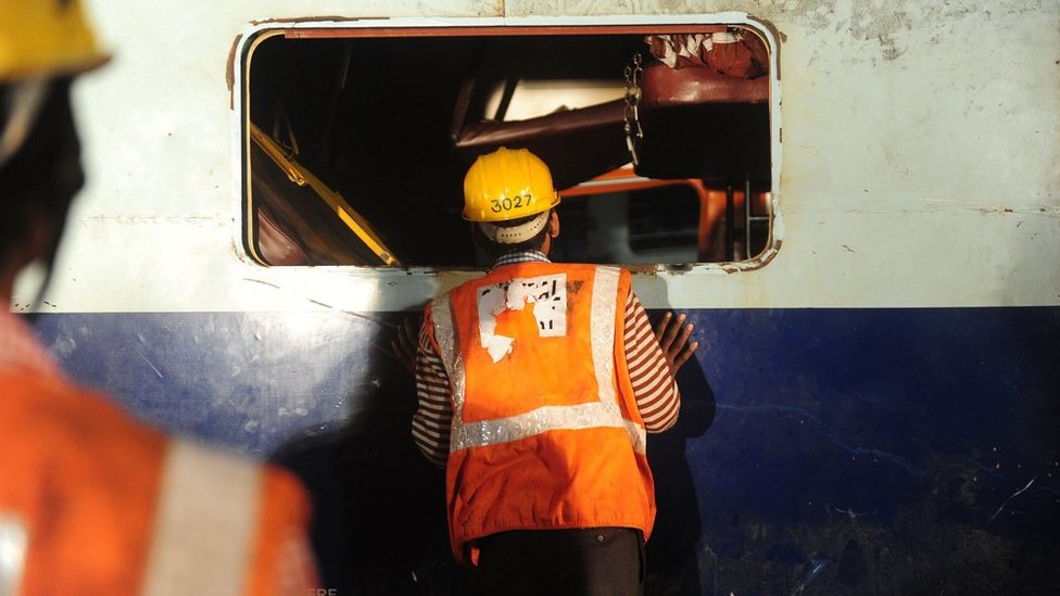 India train crash: Rescuers work overnight to find survivors