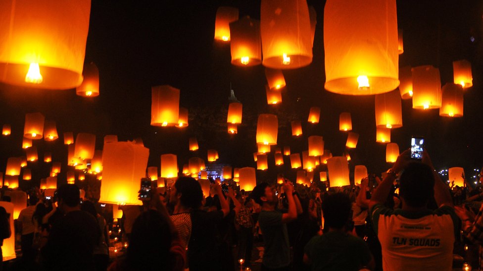 People fly lanterns at Borobudur temple during New Year celebrations in Magelang, Indonesia, January 1, 2018 in this photo taken by Antara Foto.