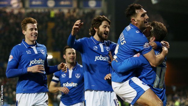 Portsmouth players celebrate Marc McNulty's goal