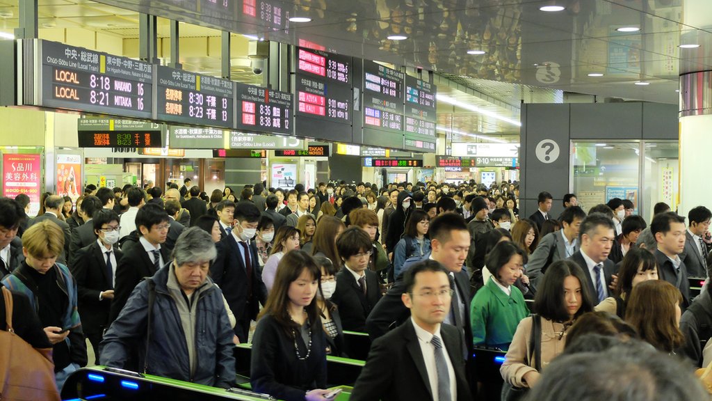Commuters at Shinjuku station in Tokyo