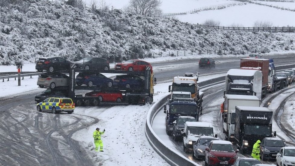 Jack-knifed car transporter on M80 near Falkirk