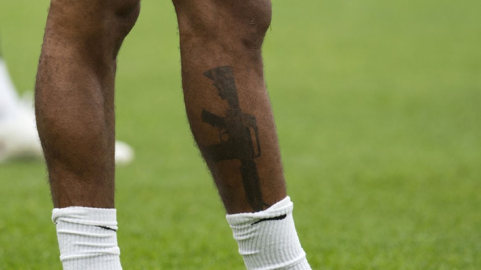 England forward Sterling defends gun tattoo