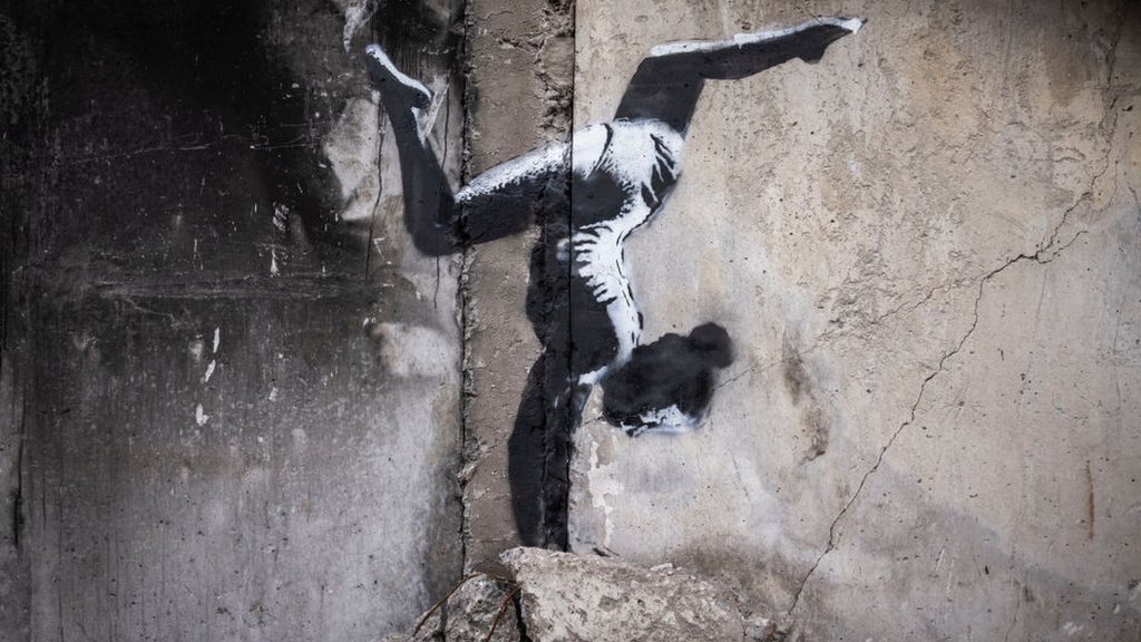 Banksy unveils Ukraine mural on shelled building
