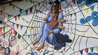 Woman trapped in spider web by the Kolor Kathmandu collective