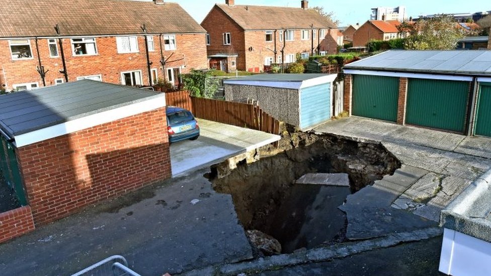 Sinkhole opens in Gosforth street - BBC News
