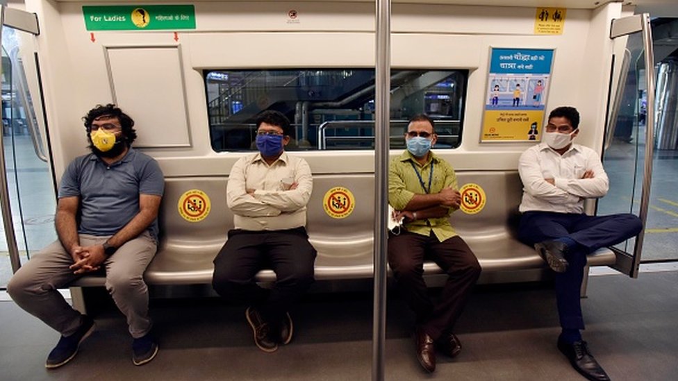 Passengers seated while maintaining social distancing in a metro coach during a press preview of Delhi Metro Rail Corporation (DMRC) preparedness ahead of metro services resuming on September 3, 2020