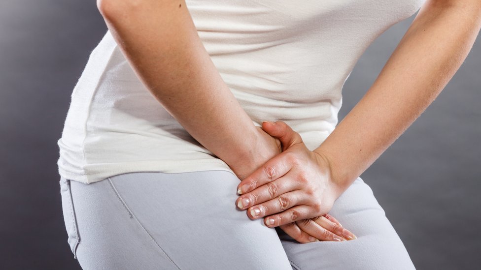 Mujer con dolor.