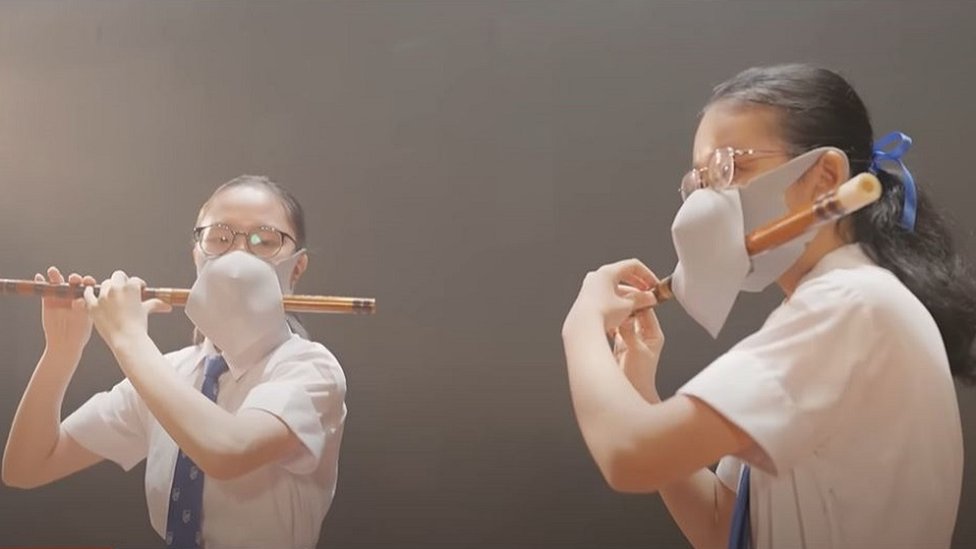 Double-masked Hong Kong flautists spark ridicule
