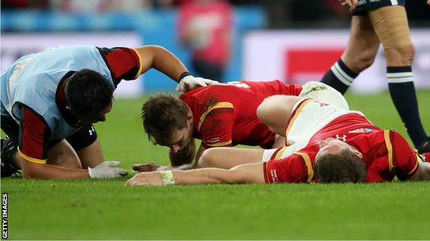 Liam Williams and Dan Biggar receive treatment during Wales' World Cup 2015 match against England.