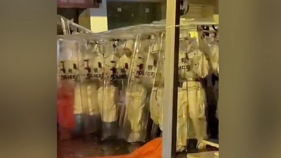 Riot police in hazmat suits at China protests