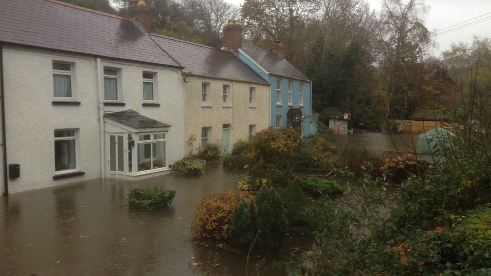 South Wales homes flood as more rain due