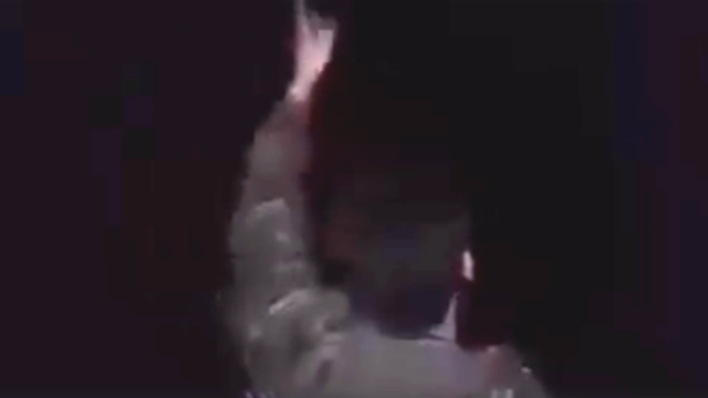 Image of a man with his back to the camera