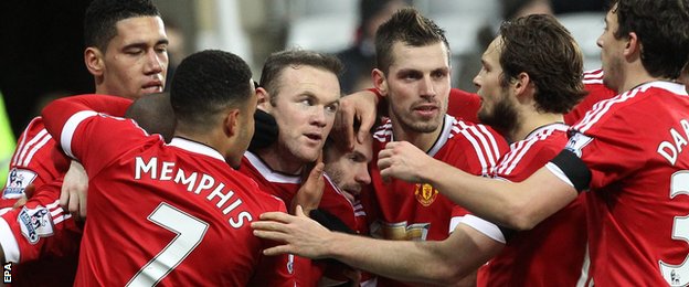 Wayne Rooney (centre) is congratulated by team-mates
