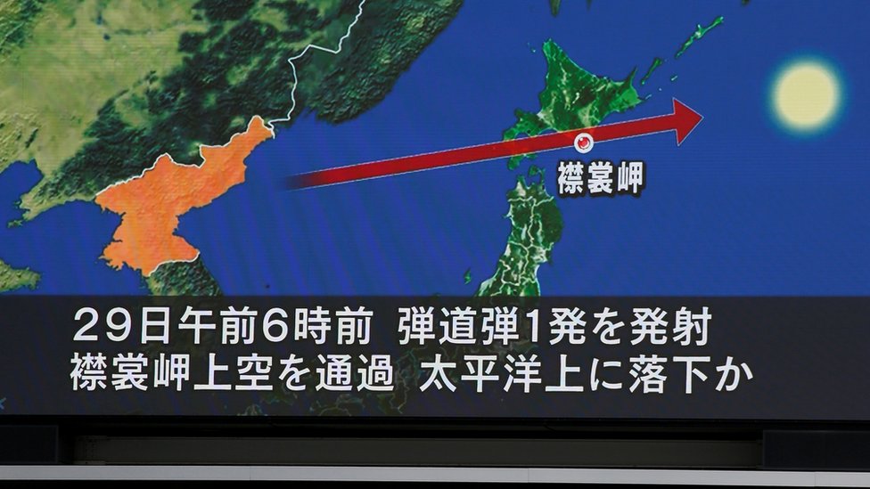 A TV screen in Tokyo, Japan, display a projected path of the North Korean IRBM, 14 September 2017