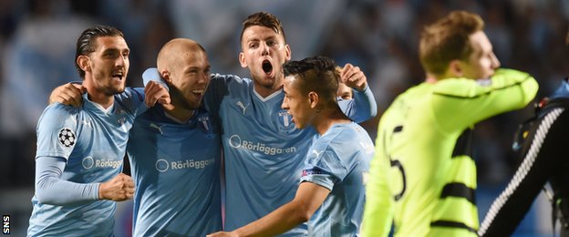 Malmo celebrate as Celtic midfielder Kris Commons trudges off 