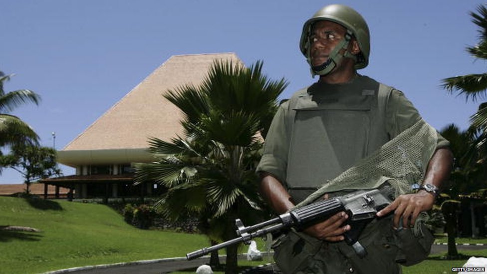 Fiji military soldier stands guards at the parliament building in Fiji's capital Suva