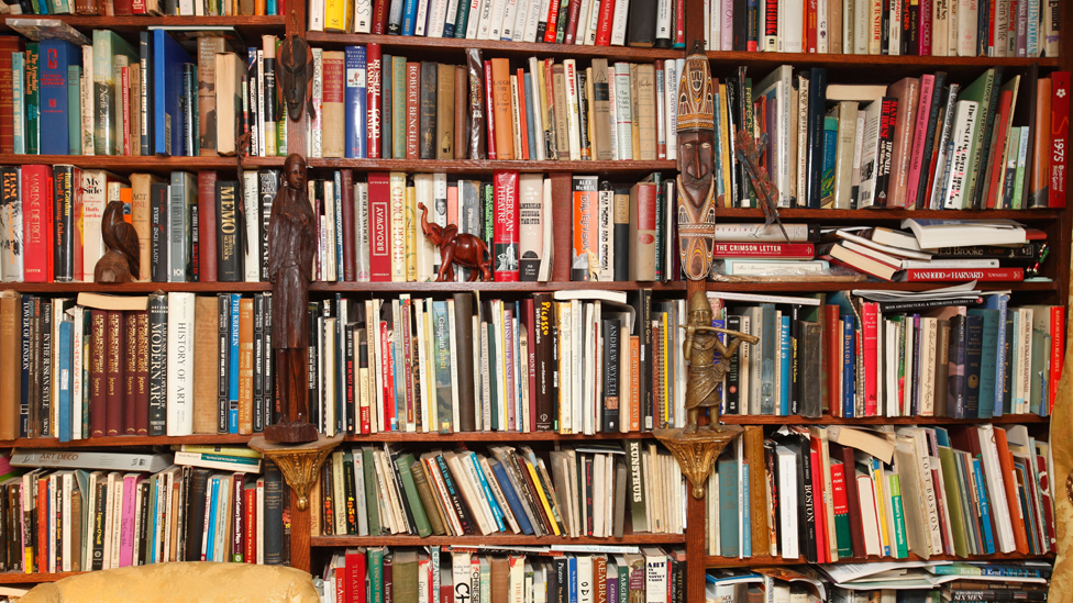 Over-full bookshelf