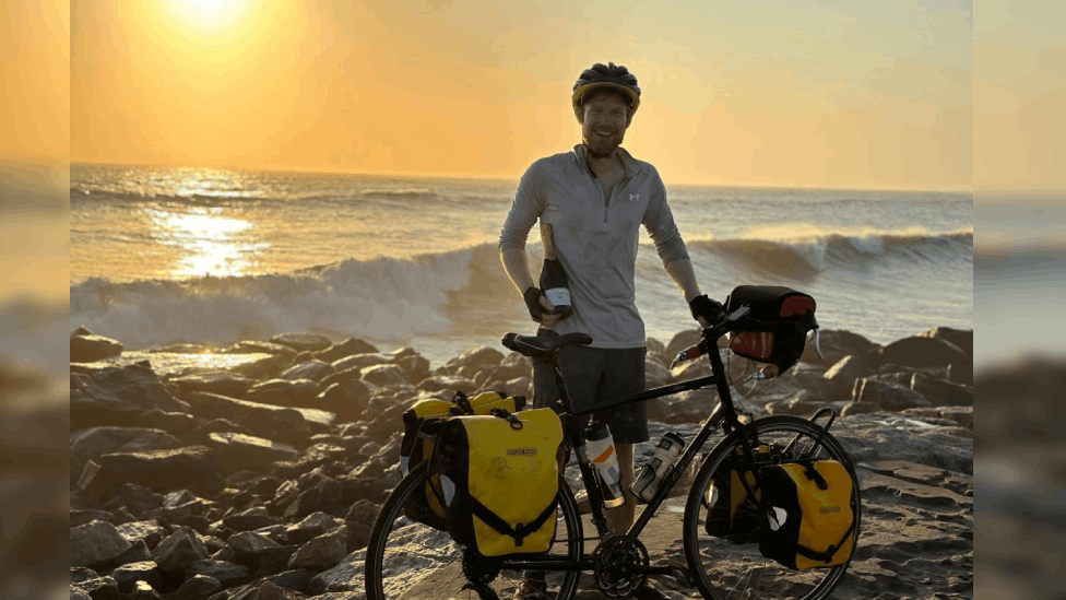 Cyclist finishes coast-to-coast ride across Africa