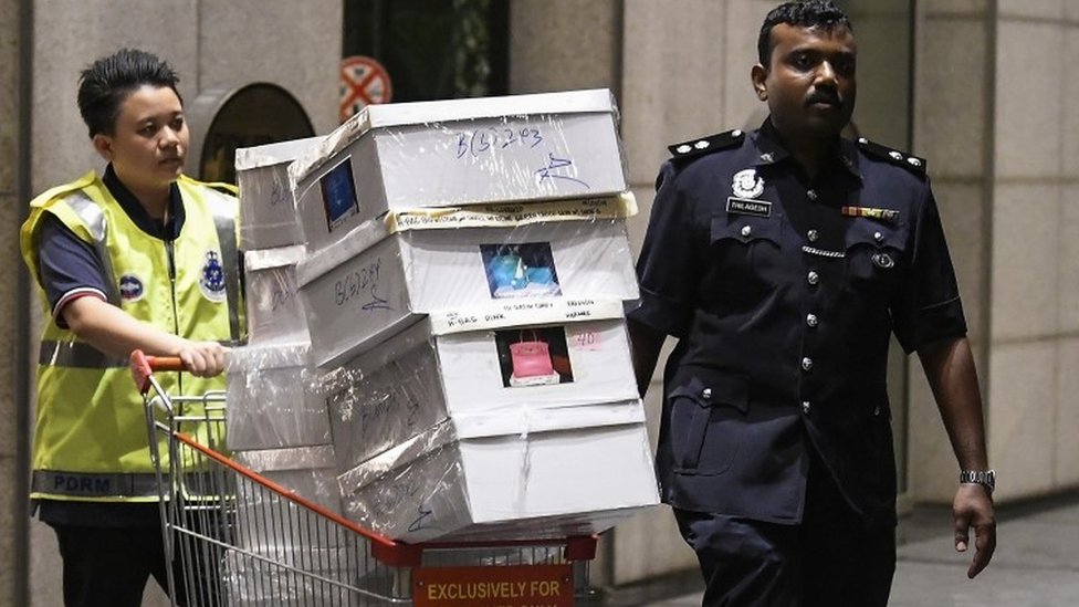 Malaysia police seize money and luxurious items in Najib-linked raids