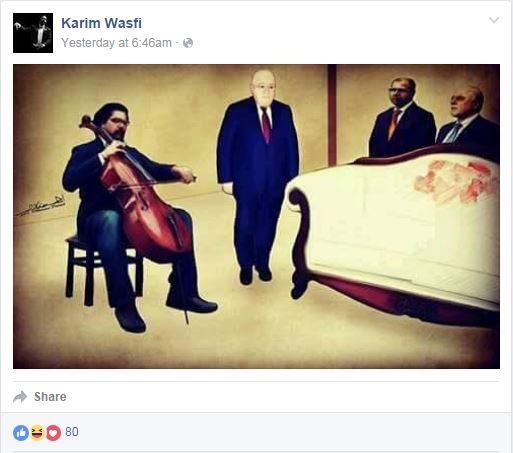 Iraqi cellist Karim Wasfi plays near the stained white sofa
