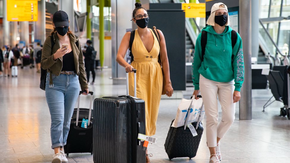 Travellers arriving at London Heathrow Airport