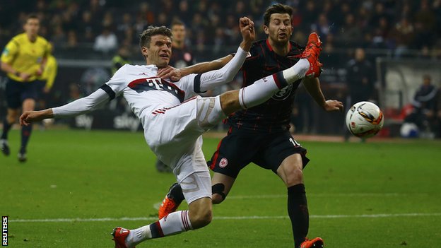 Bayern's Thomas Muller battles for possession with Eintracht Frankfurt's Abraham