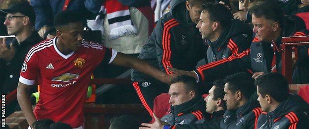 Anthony Martial shakes hands with Louis van Gaal