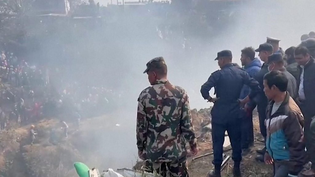 Crowds gather at Nepal plane crash site
