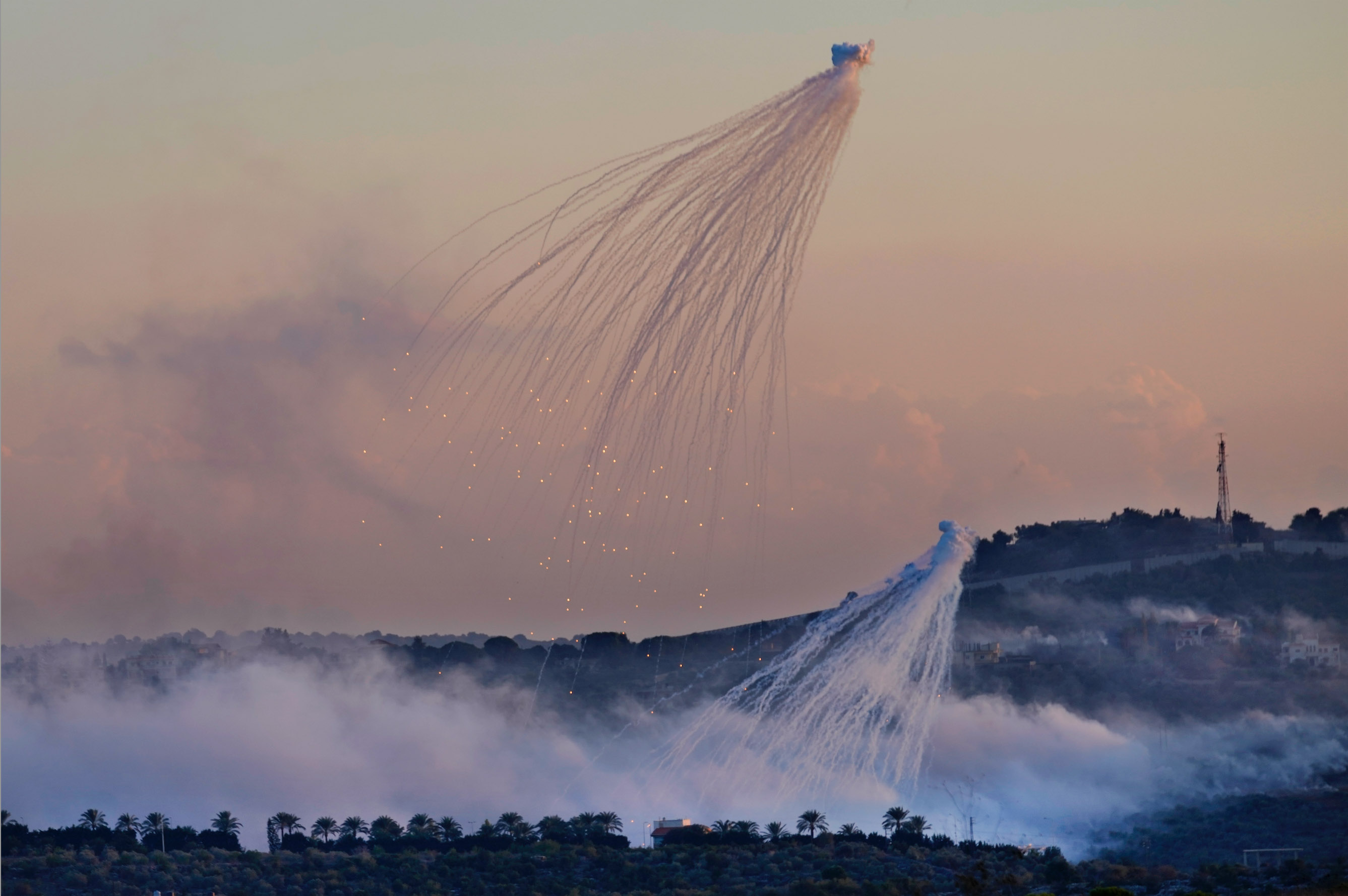 This image, taken on 16 October over Dhayra, shows the typical octopus shaped smoke cloud. It's tendrils still alight, as the toxic munitions fall towards the earth. Home to approximately 30 families, Dhayra is surrounded by grazing lands and olive groves