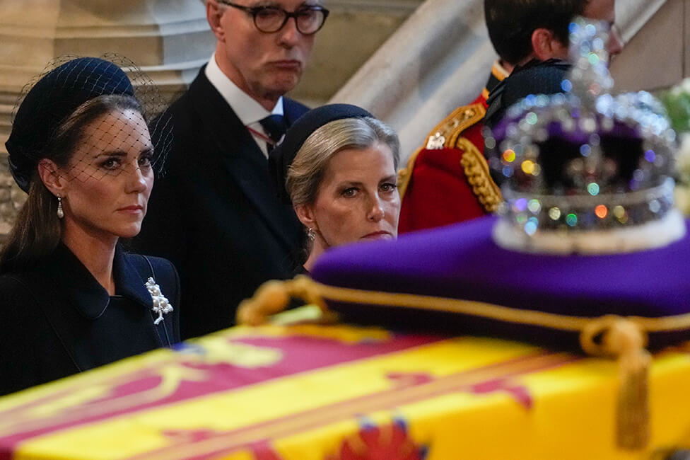 Catherine, Princess of Wales and Sophie, Countess of Wessex watch the coffin of Queen Elizabeth II