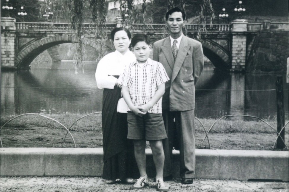 An undated handout photo made available by Samsung Group on 25 October 2020 shows Chairman Lee Kun-hee (C) as a child together with his parents, in South Korea