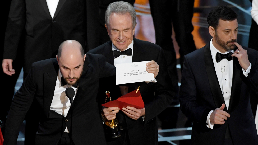 La La Land producer Jordan Horowitz (L) holds up the winner card reading actual best picture winner Moonlight after a presentation error with actor Warren Beatty and host Jimmy Kimmel onstage during the 89th Annual Academy Awards at Hollywood & Highland Center on February 26, 2017 in Hollywood, California