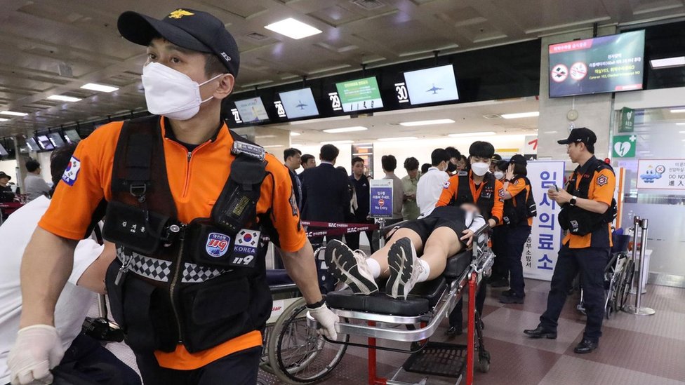 Asiana Airlines Passenger Opens Emergency During Landing, 12 Injured