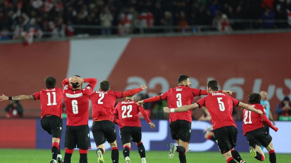 Georgia players celebrate beating Greece on penalties to reach the Euro 2024 Finals