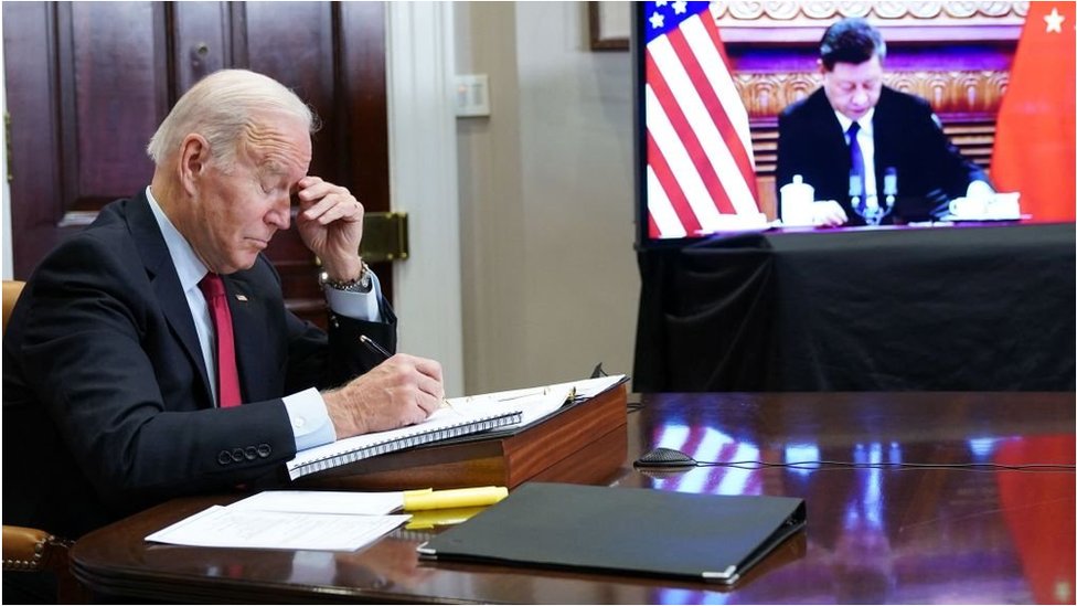 US President Joe Biden gestures as he meets with China's President Xi Jinping during a virtual summit from the Roosevelt Room of the White House in Washington, DC, November 15, 2021.