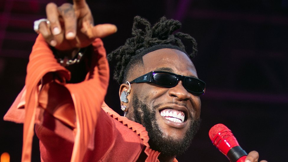 Burna Boy's Dramatic Stage Stumble During Performance Sparks Laughter Online