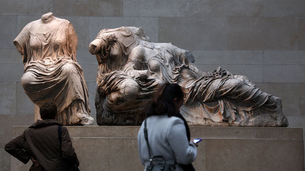 Visitors look at the Elgin Marbles, at the British Museum in London