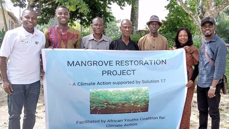 Ukpe Benson Udoh plants mangrove trees to 'fight against rising sea water levels'