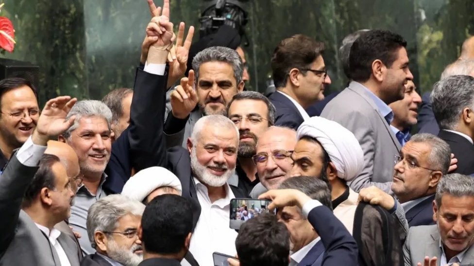 Ismail Haniyeh, surrounded by Iranian lawmakers at the Iranian parliament in Tehran on Tuesday