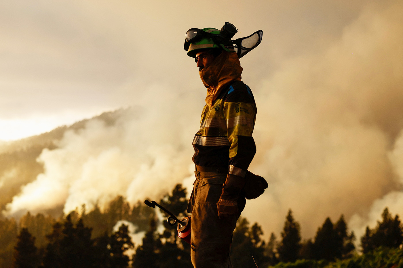 A forest firefighter tackles the Tijarafe fire on the Canary Island of La Palma - 16 July 2023