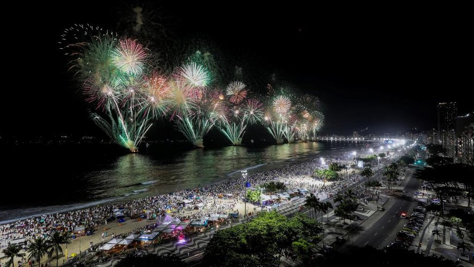 Fireworks fill the sky over Copacabana beach, in Rio de Janeiro