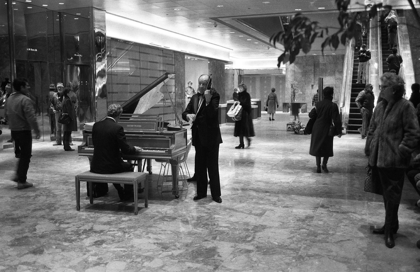 Musicians play piano and violin in the foyer at the newly-opened Trump Tower on 18 February 1983