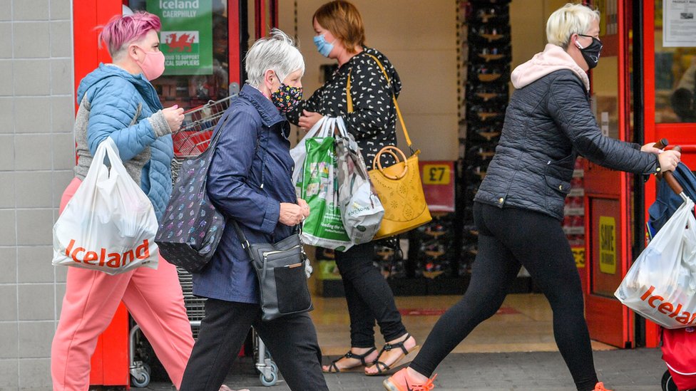Shoppers wear masks