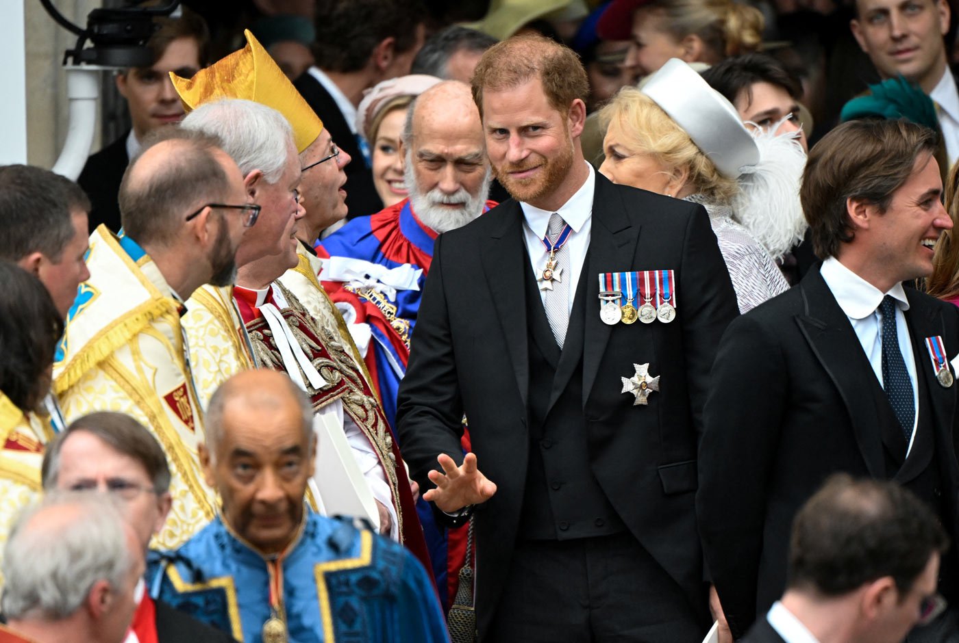 Prince Harry, Duke of Sussex, leaves Westminster Abbey following the coronation ceremony