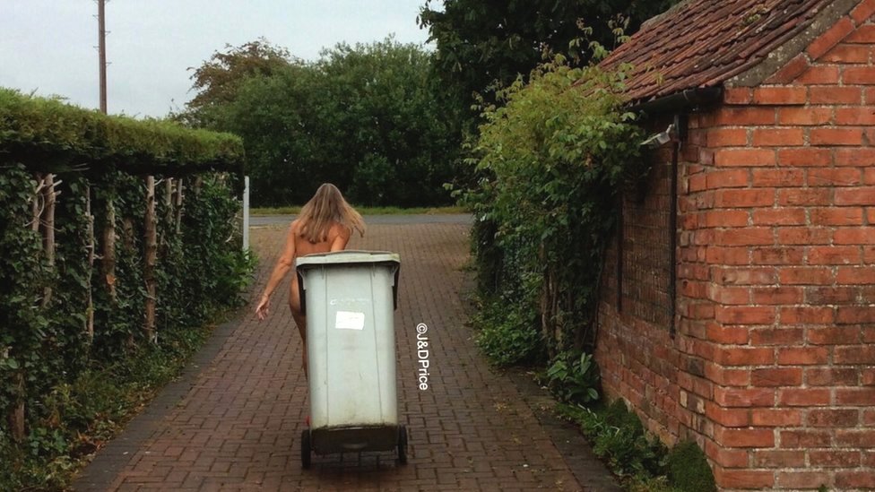 British naturist Donna Price taking the bin out from home